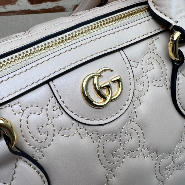 G*u*i gg matelassé leather top handle bag