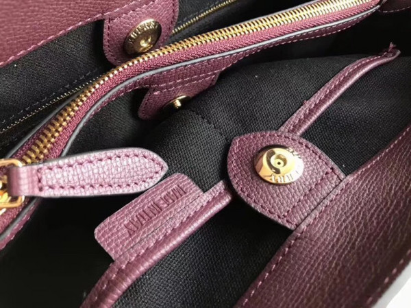 B**rry the medium banner in leather and house check